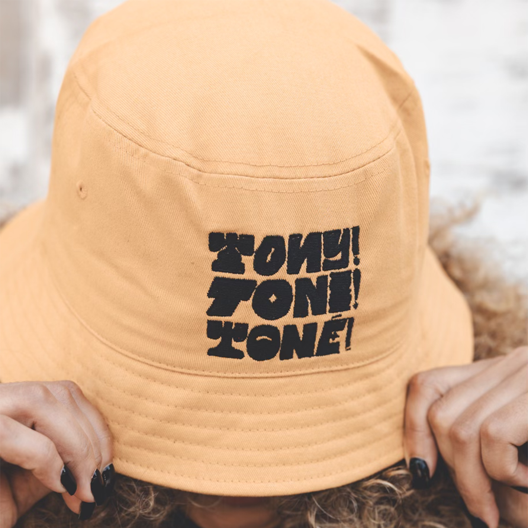 Tony! Toni! Toné! "Stacked Logo" Bucket Hat in Gold